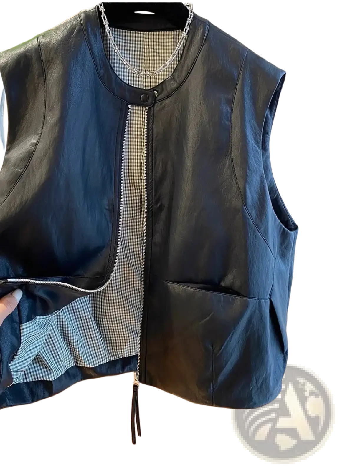Black faux leather vest for women with front zipper closure and checkered interior lining for casual outerwear