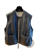 Black faux leather vest for women with zipper front, two large patch pockets, and subtle checkered lining at neckline
