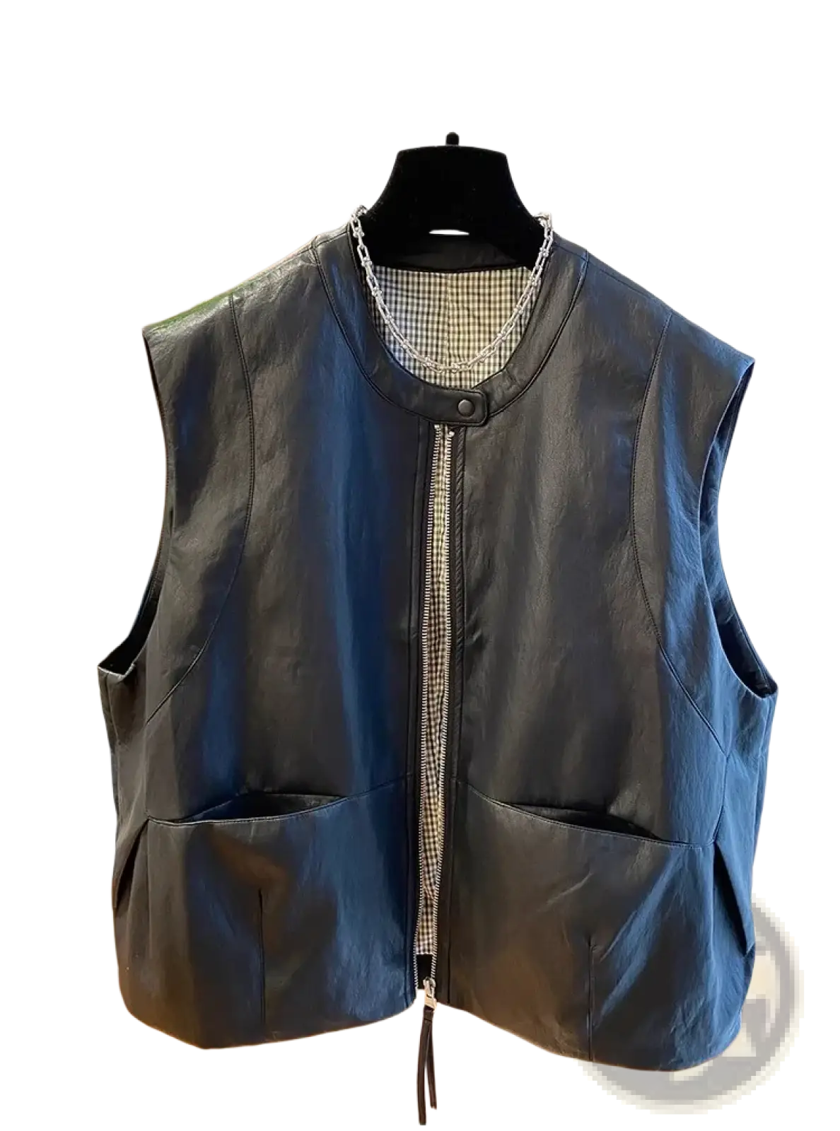Black faux leather vest for women with zipper front, two large patch pockets, and subtle checkered lining at neckline