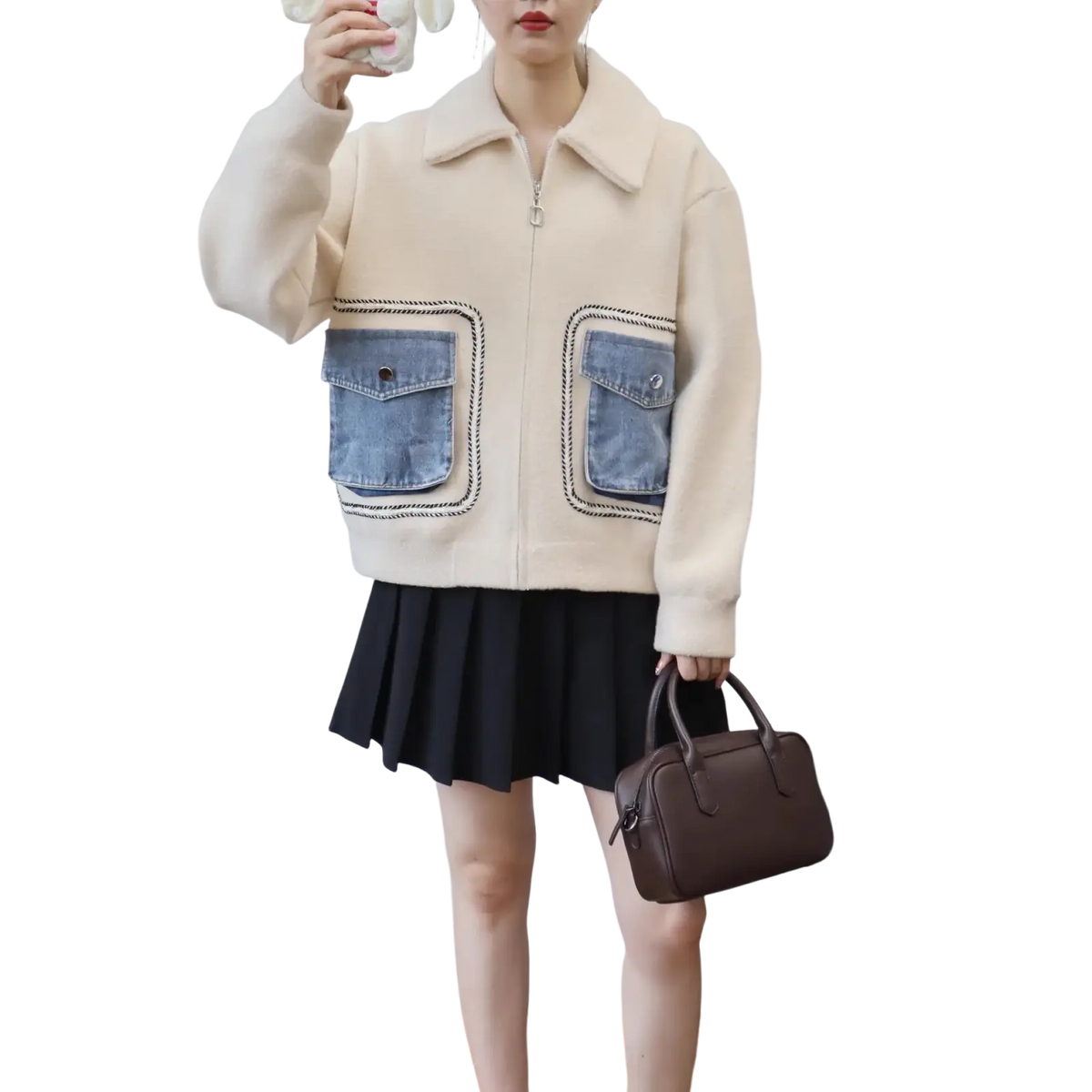 Cream-colored faux shearling jacket with denim patch pockets and black stitching for stylish outerwear