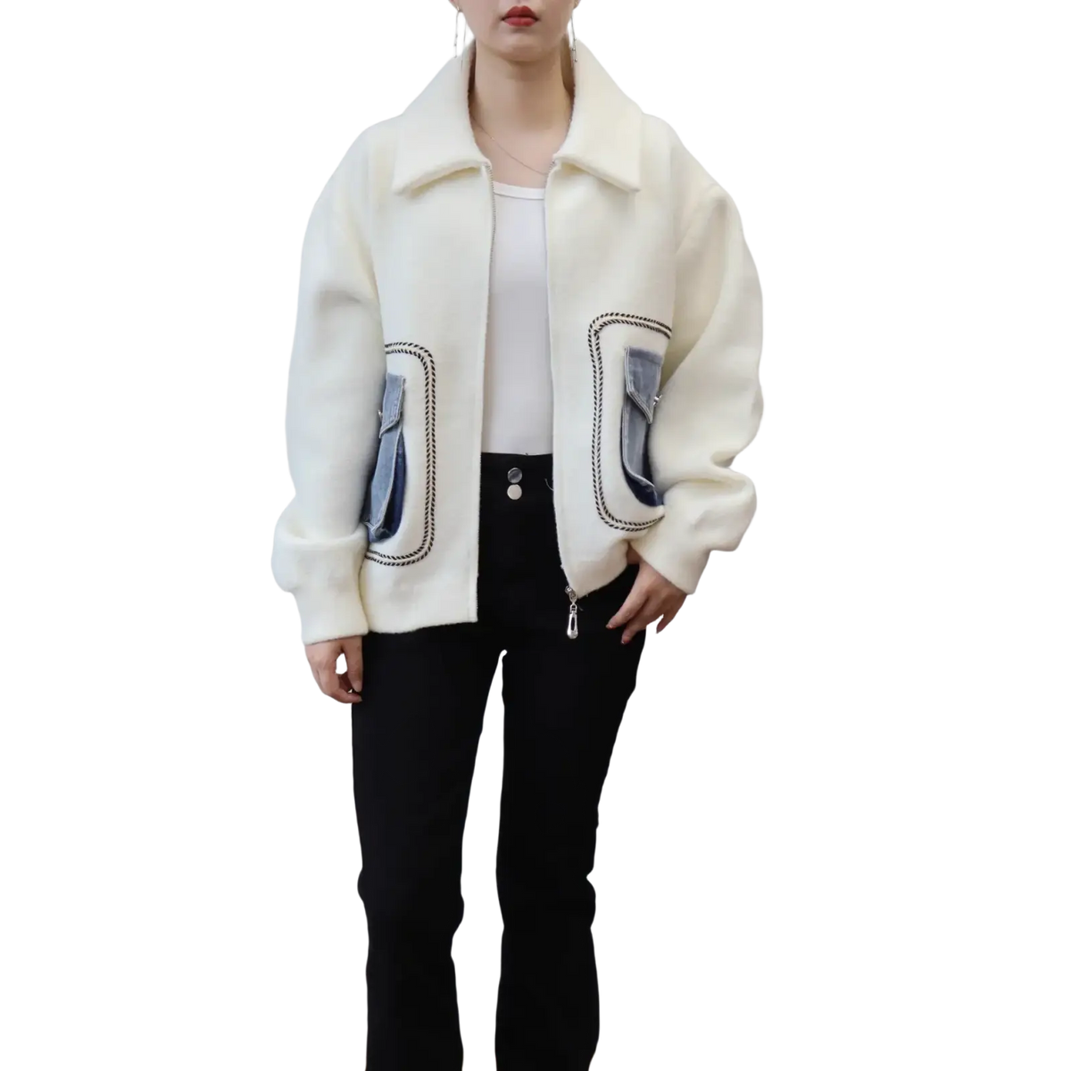 Cream-colored faux shearling bomber jacket with denim patch pockets and black stitching for stylish outerwear