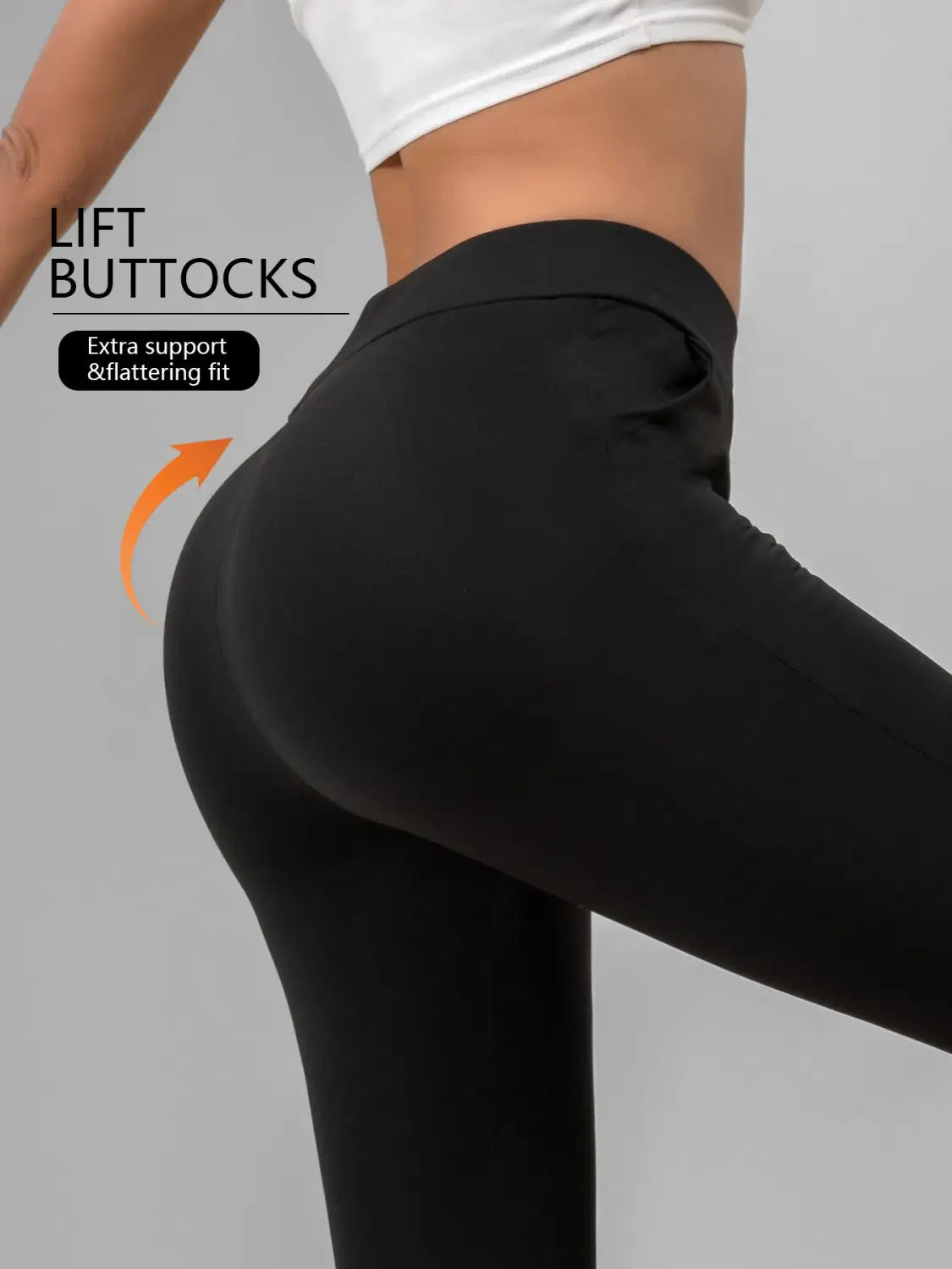 black high-waisted sharkskin leggings with a snug, form-fitting design for extra support and a flattering fit shown from the back side
