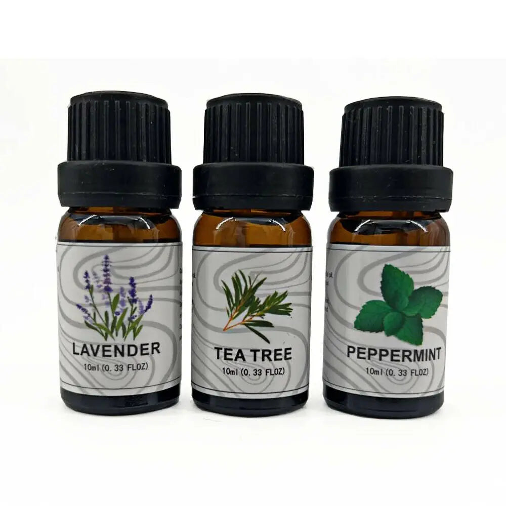 Three amber glass essential oil bottles with black ribbed caps and white labels featuring botanical illustrations for lavender tea tree and peppermint in an essential oil set 3 pack.