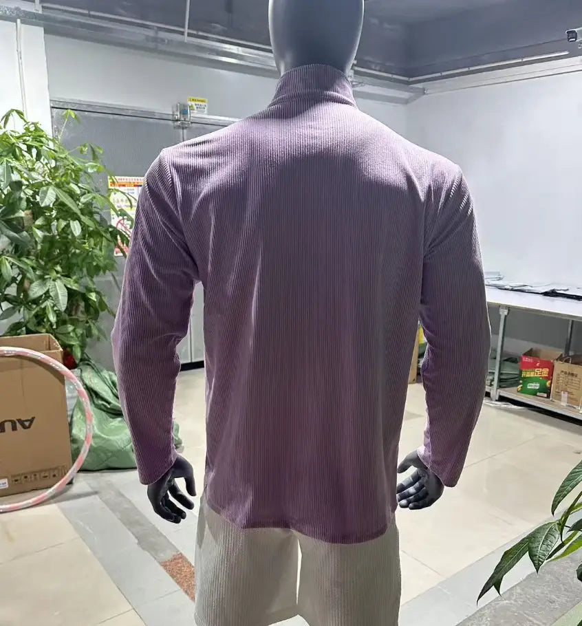 Men’s ribbed knit half zip corduroy polo sweatshirt in purple featuring a long-sleeved design with a high collar.