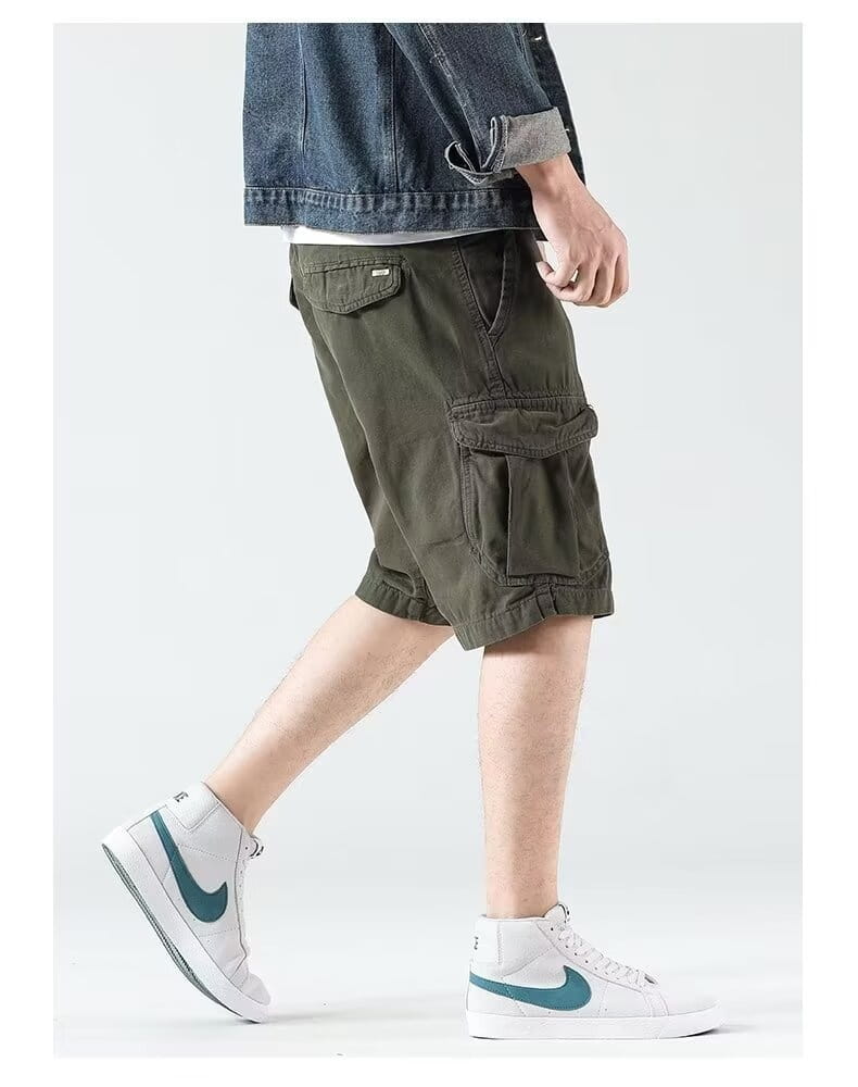 Men’s relaxed fit multi pocket cargo shorts in olive green featuring a comfortable relaxed fit and multiple functional pockets for practical everyday wear.