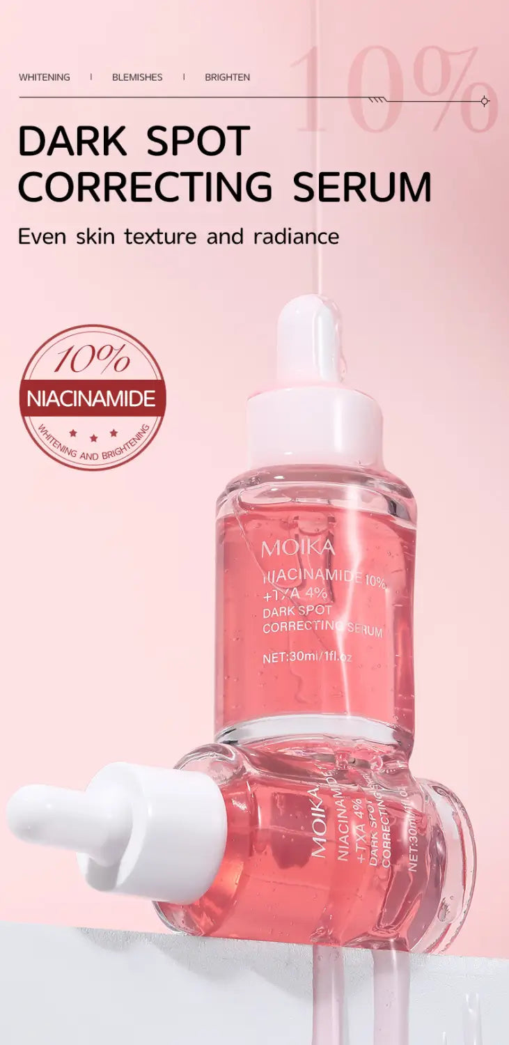 A clear glass bottle with a white dropper cap containing pink liquid labeled moika dark spot correcting serum with 10 percent niacinamide from niacinamide 10 percent Txa 4 percent dark spot correcting serum 30ml.