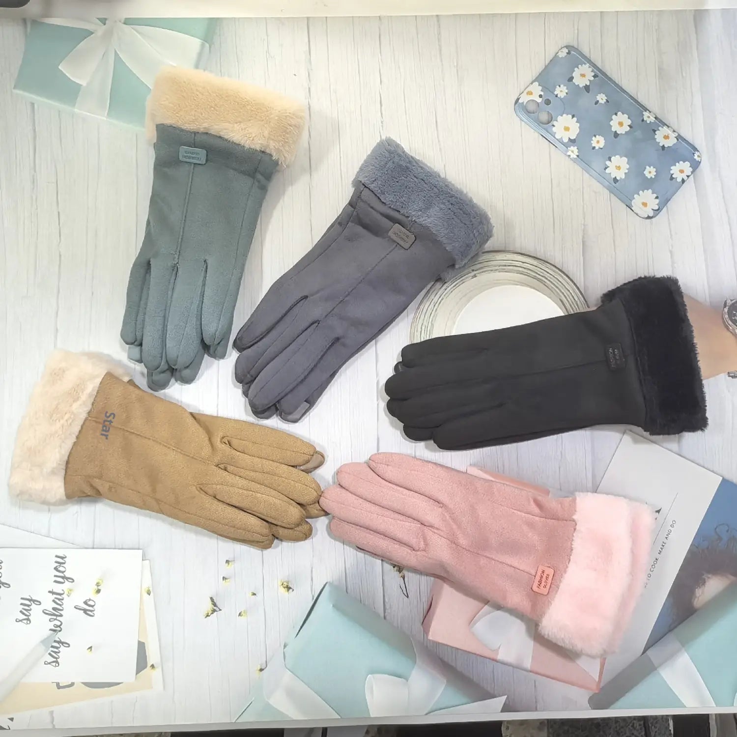 a set of five women’s thermal suede touchscreen gloves in gray black tan and pink with plush fur lined cuffs designed for winter use