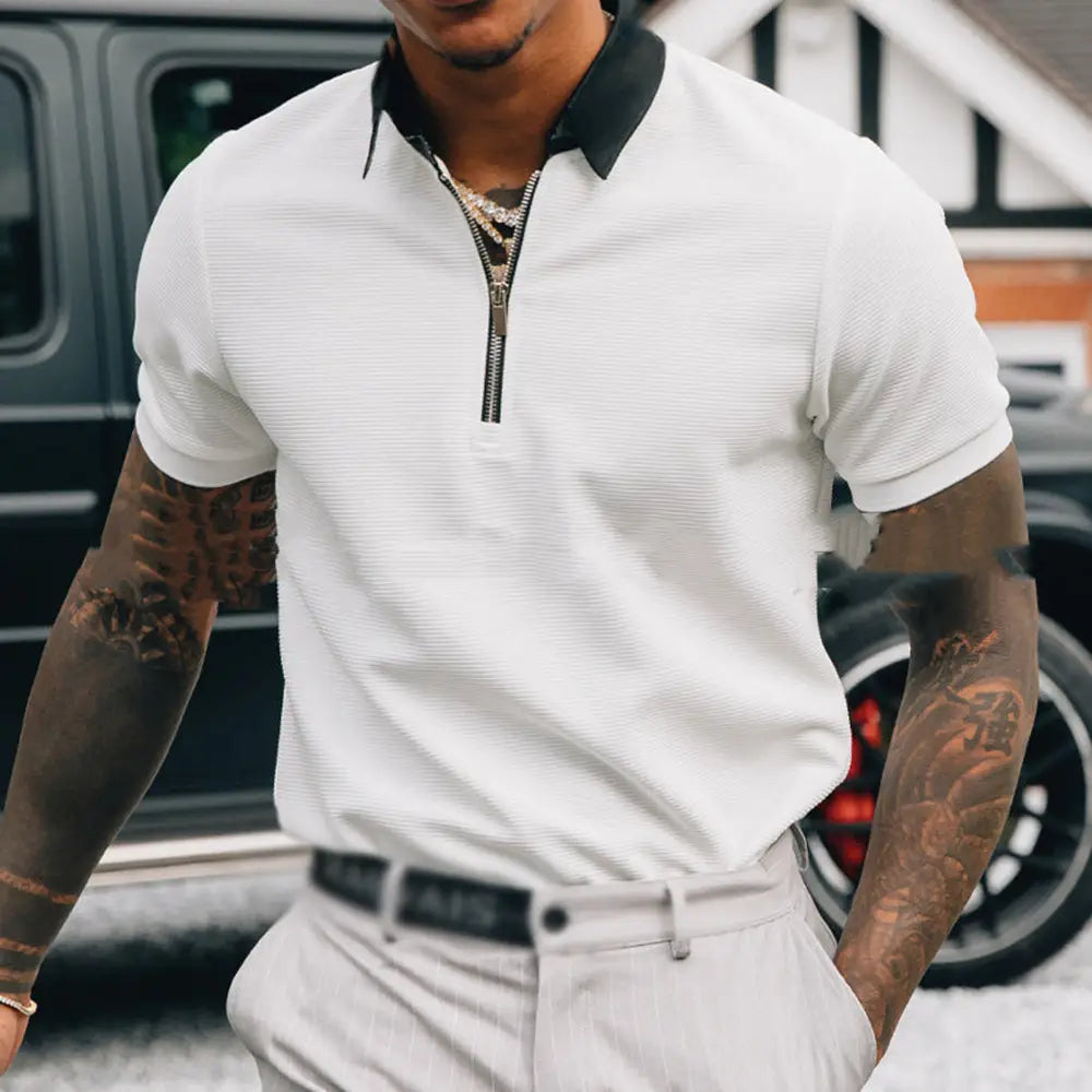 Men’s textured white polo shirt with black contrast collar and zipper detail in short-sleeve design.