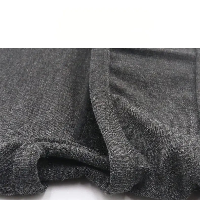 Dark gray heathered fabric with a soft textured knit on the back side of a dog anxiety jacket and breathable thunder vest designed for comfort and calming.