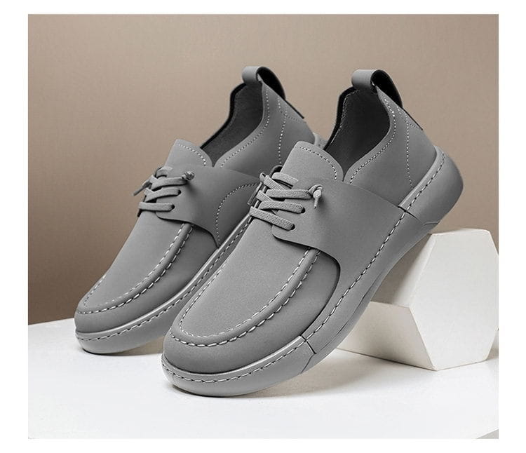 Chaussures en cuir rétro britanniques élégance décontractée pour homme, en cuir gris, avec couture blanche et col rembourré.
