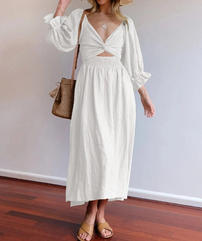 a flowing off-white v-neck lantern sleeve reversible midi dress with a deep v-neckline smocked waistband and puffed sleeves