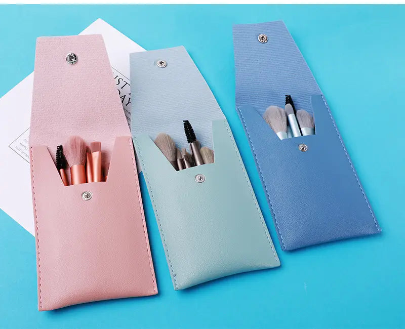 makeup brush set with 8 pieces featuring pastel-colored leather cases in pink mint green and blue for stylish and organized storage.