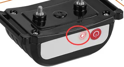 Black plastic 2-in-1 wireless dog fence and remote training collar with silver screws and white panel featuring red power button.