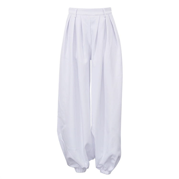 White high waisted balloon jogger pants with a loose pleated silhouette and elastic cuffs.