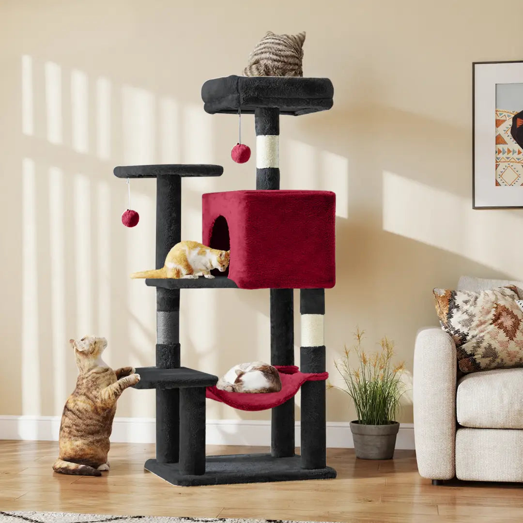 Red and black 44 inch multi-level cat tree tower with sisal scratching posts, a cozy hammock, and hanging toys for cats.