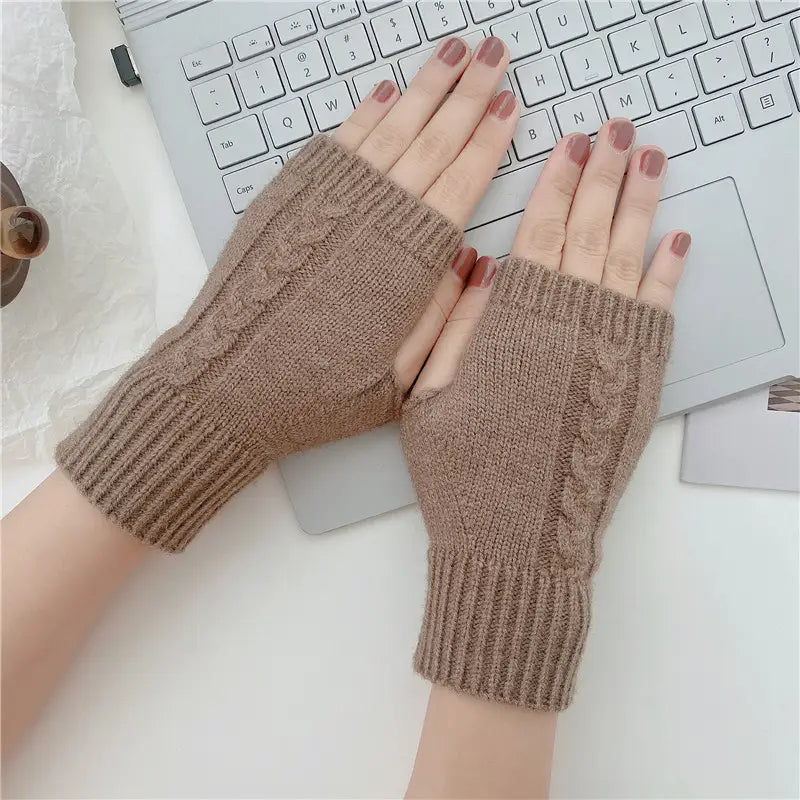 Beige woolen cable knit fingerless gloves with ribbed cuffs designed as unisex winter accessories.