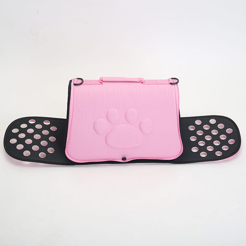 Eva folding pet carrier bag in pink with black perforated side panels designed for comfortable pet transport.