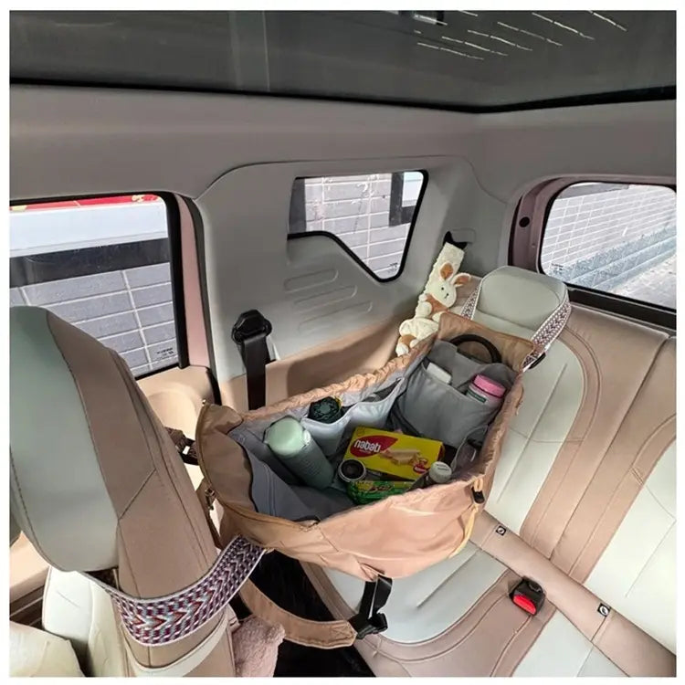 Beige and gray fabric car seat organizer with patterned trim made of waterproof nylon designed as a multifunctional fashion tote and backpack.