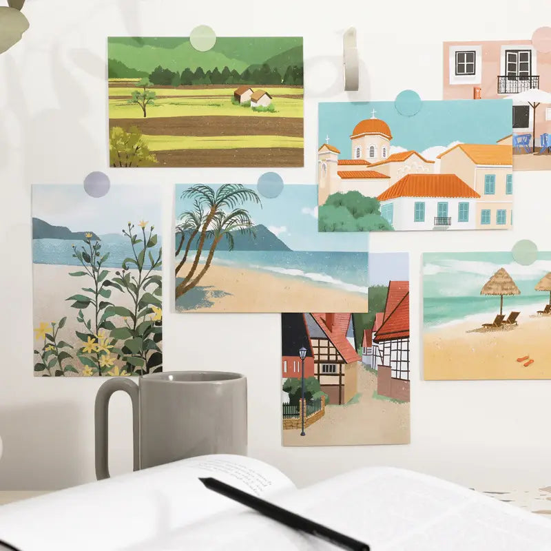 Gray ceramic mug with a smooth glossy finish and curved handle shown alongside the travel diary winter postcards wall decor 15 pack.