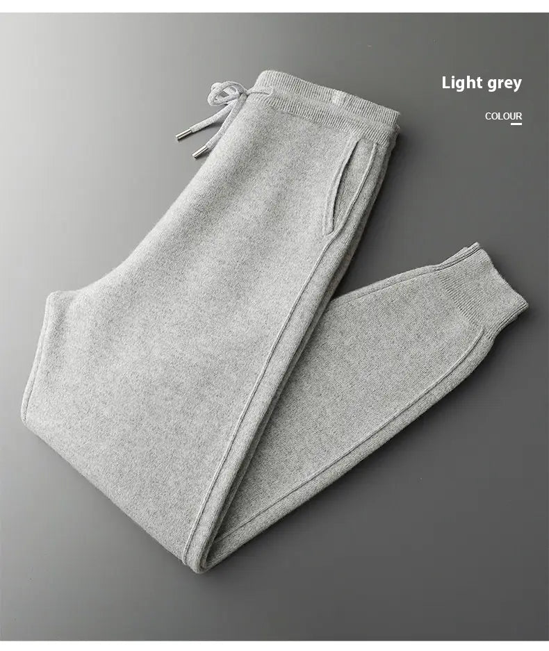 Light grey wool men’s harem pants high waist casual joggers with a knit texture drawstring waistband and ribbed cuffs.