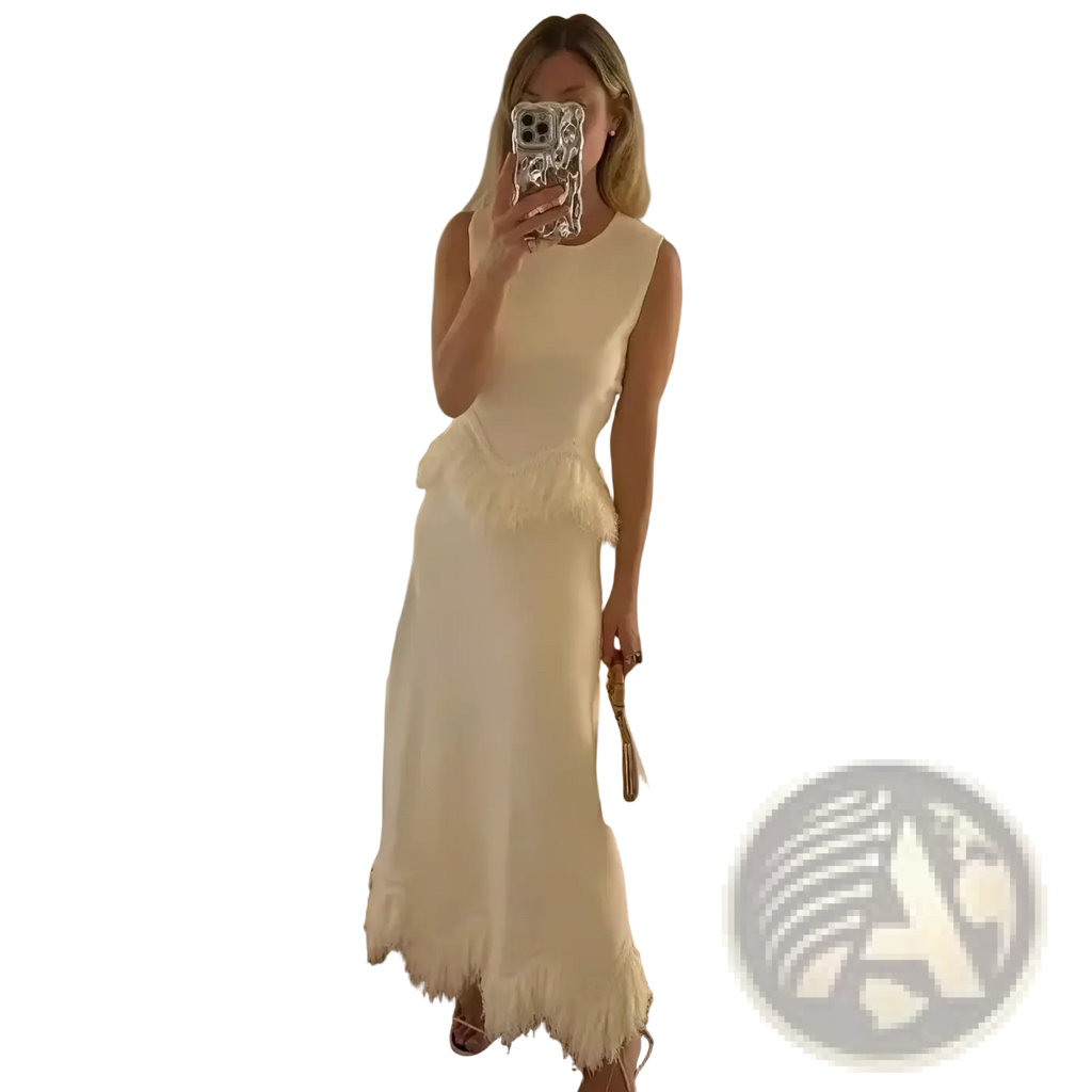Off-white sleeveless two-piece maxi dress set with fitted bodice and feather trim hemline