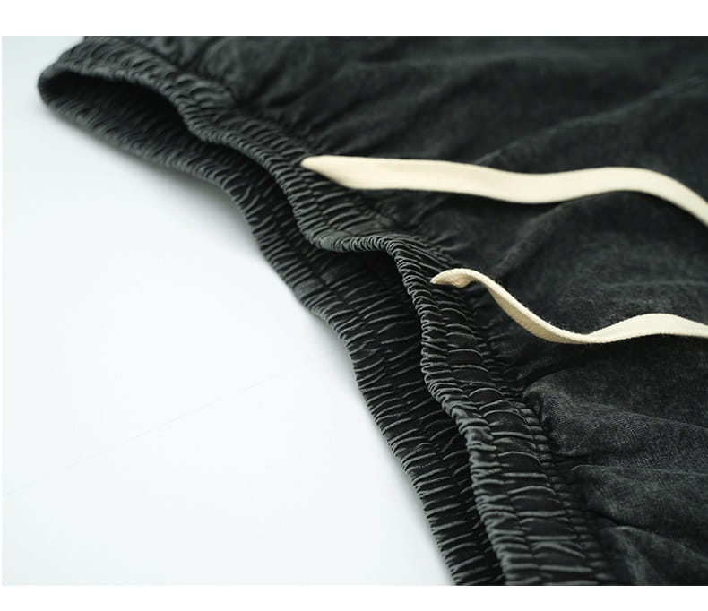 mens distressed cotton shorts in black corduroy with cream-colored drawstrings designed for vintage snowflake summer apparel.
