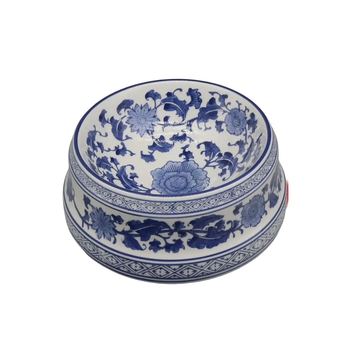 A classic blue and white feeding bowl ceramic with intricate floral patterns and a glossy porcelain finish