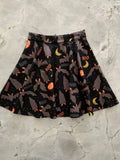 Feelin batty plus size 1x halloween skater skirt in black pleated fabric with orange bats yellow moons and boo print