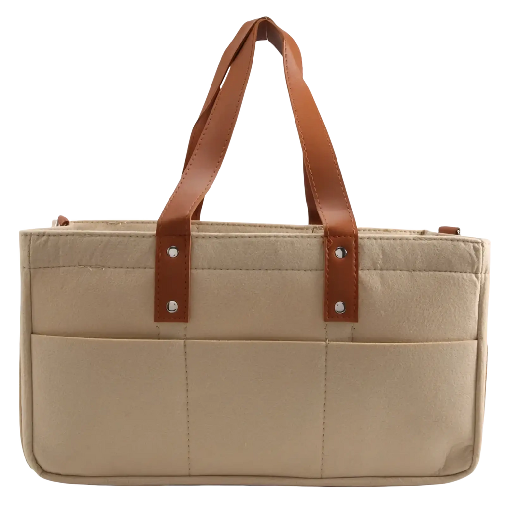 Beige felt baby diaper caddy nursery storage basket with canvas material brown leather handles and silver hardware