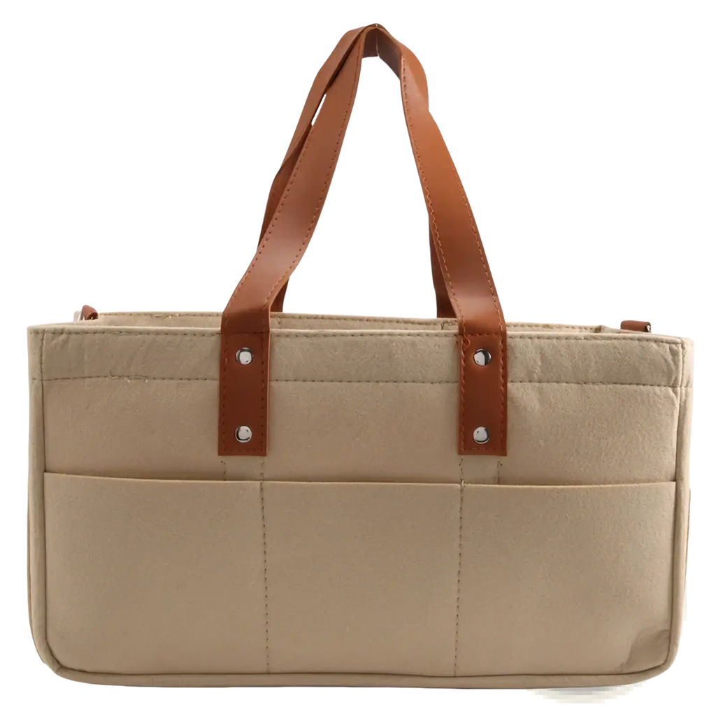Beige felt baby diaper caddy nursery storage basket with canvas material brown leather handles and silver hardware