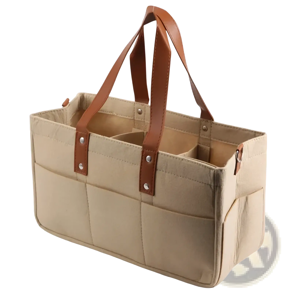 Beige canvas felt baby diaper caddy with brown leather handles and silver rivets for nursery storage organization