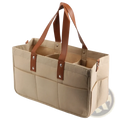 Beige canvas felt baby diaper caddy with brown leather handles and silver rivets for nursery storage organization