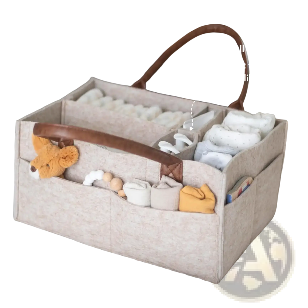 Beige felt baby diaper caddy organizer bag with brown leather handles and multiple compartments for essentials