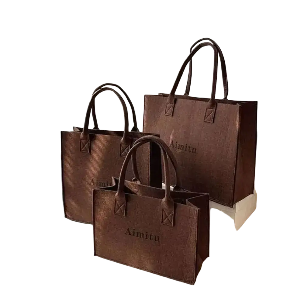 Brown leather-like large capacity tote bag with stitched handles and embossed aimitu branding for crossbody use