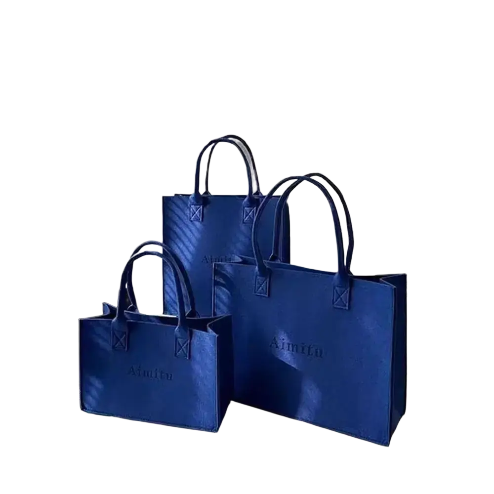 Three royal blue felt crossbody shoulder tote bags with large capacity and subtle embossed branding and matching handles