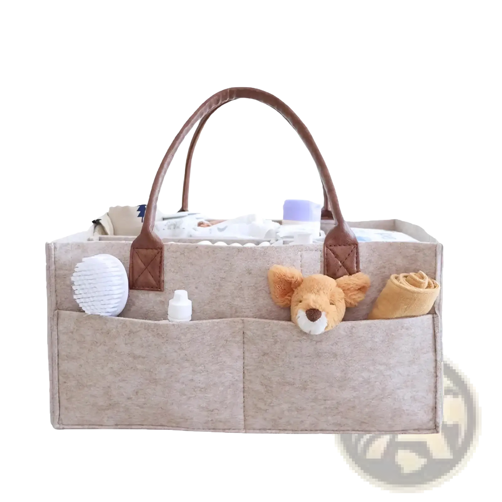 Beige felt diaper caddy nursery storage organizer with brown leather handles and multiple compartments for baby care