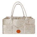 Beige felt diaper caddy organizer tote bag with orange circular accent and stitched handles for nursery storage