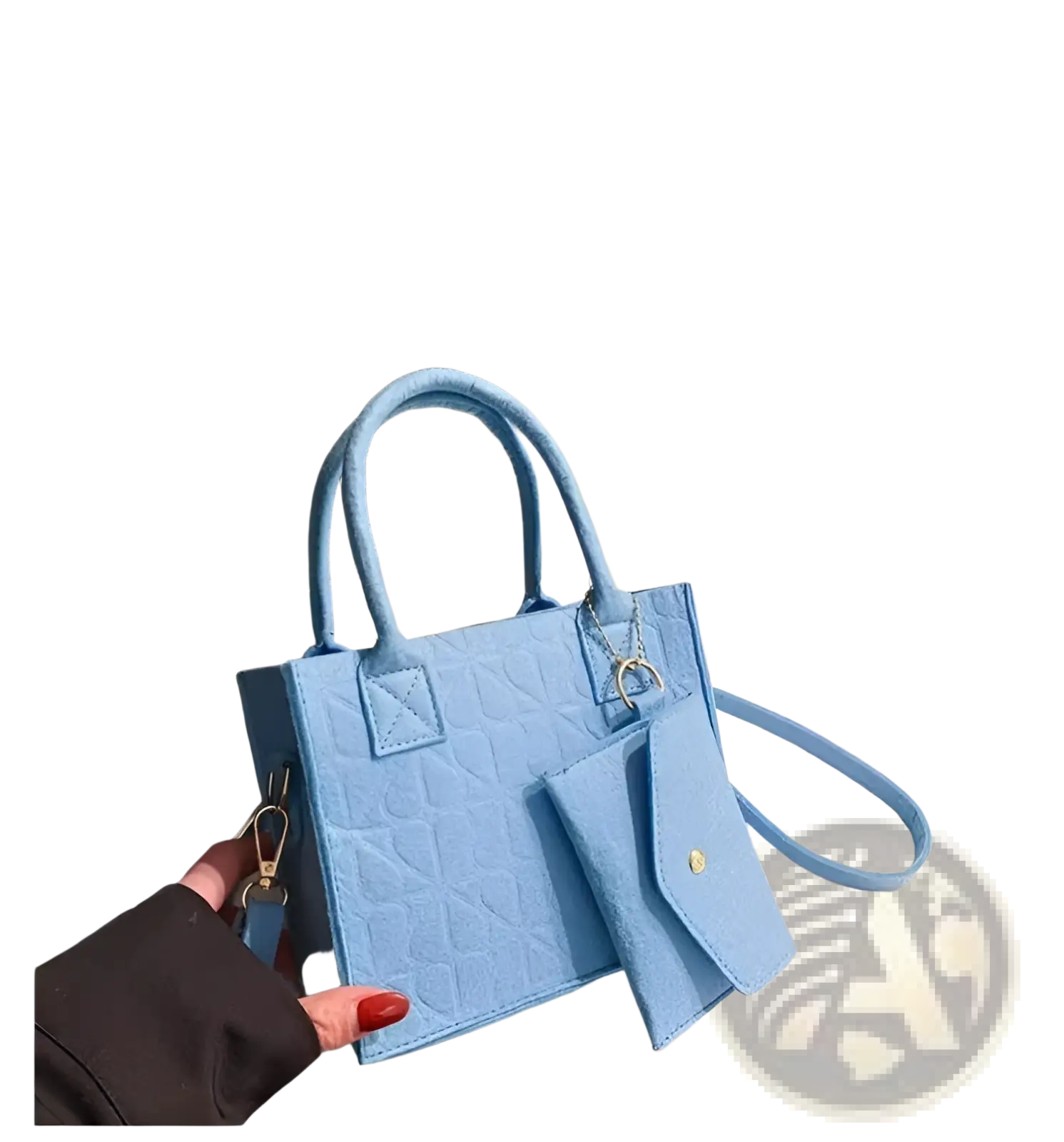 A light blue quilted faux leather mini handbag with a structured shape and detachable shoulder strap from felt handbag set