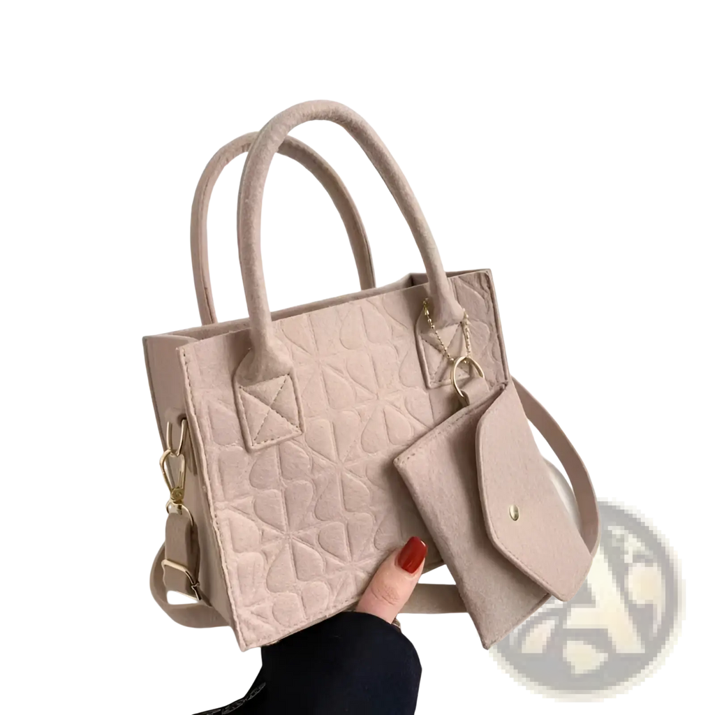 Beige felt handbag set with quilted heart pattern includes matching wallet and adjustable strap for elegant use