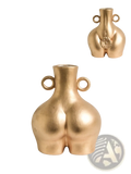 Gold-colored ceramic female body vase shaped like stylized buttocks with two circular handles and floral base design back view