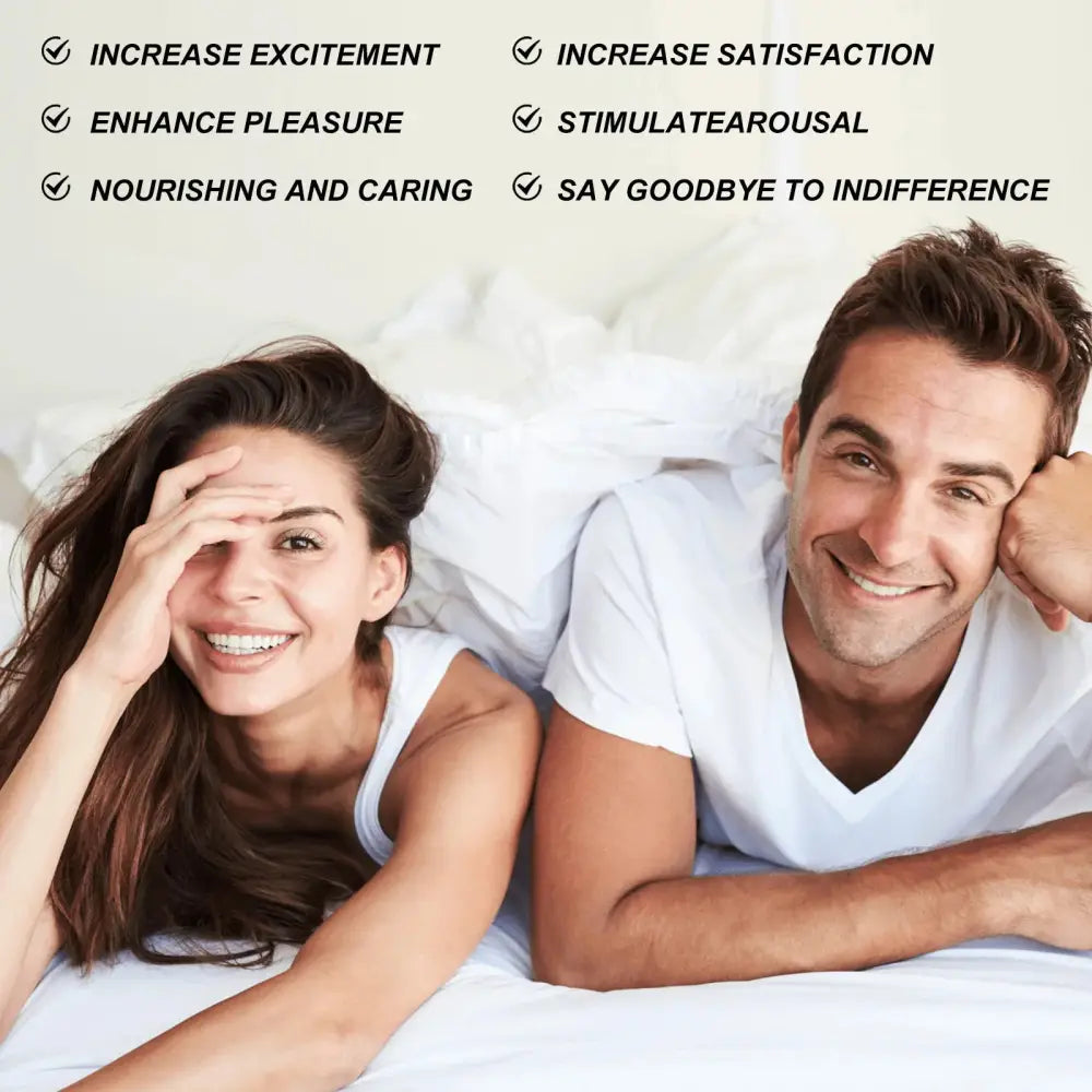 A smiling couple in white clothing lying on a bed with North Moon infatuating nourishing feminine firming essence