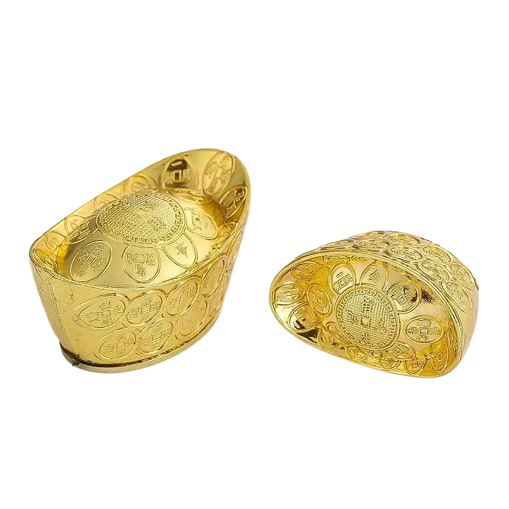 Two golden feng shui gold ingot figurines with intricate engravings and traditional characters for tabletop decor
