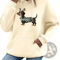 Cream-colored oversized hoodie featuring a festive dachshund graphic with reindeer antlers and a patterned sweater
