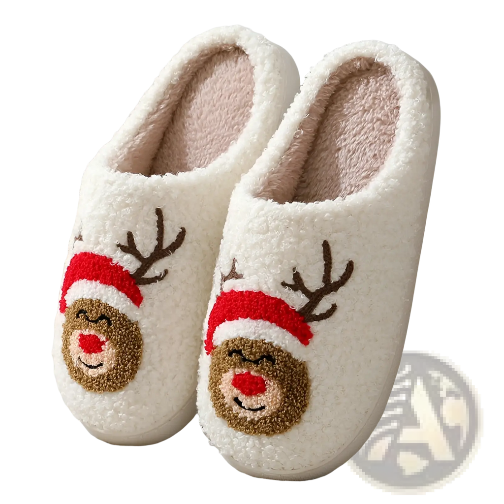 White plush winter slippers with festive embroidered reindeer faces wearing red hats and brown antlers