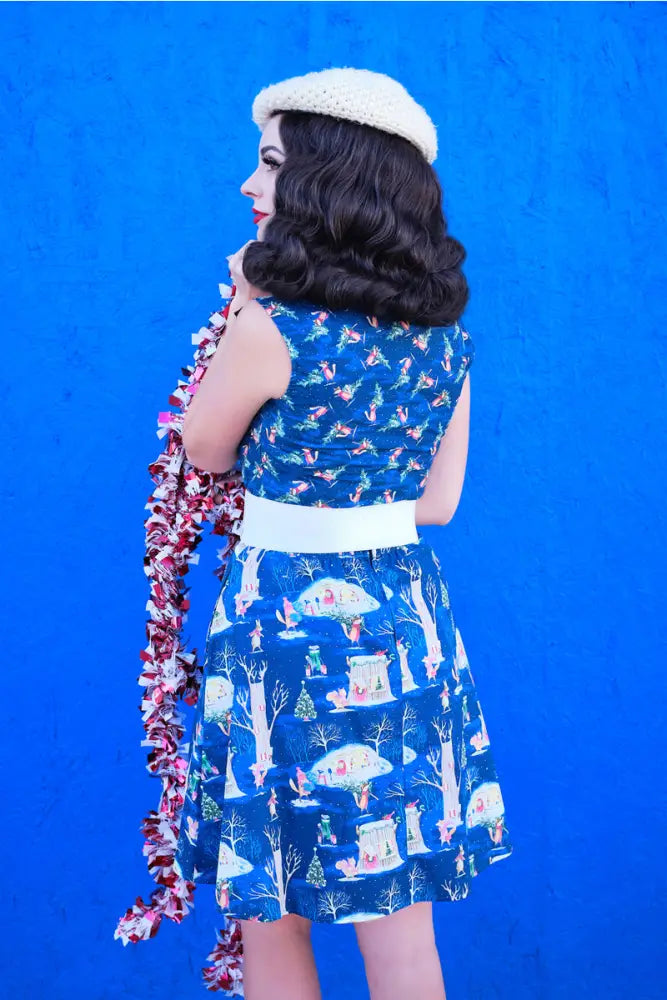 Blue festive fox print vintage bow blouse with winter scene pattern and white belt in size 1x