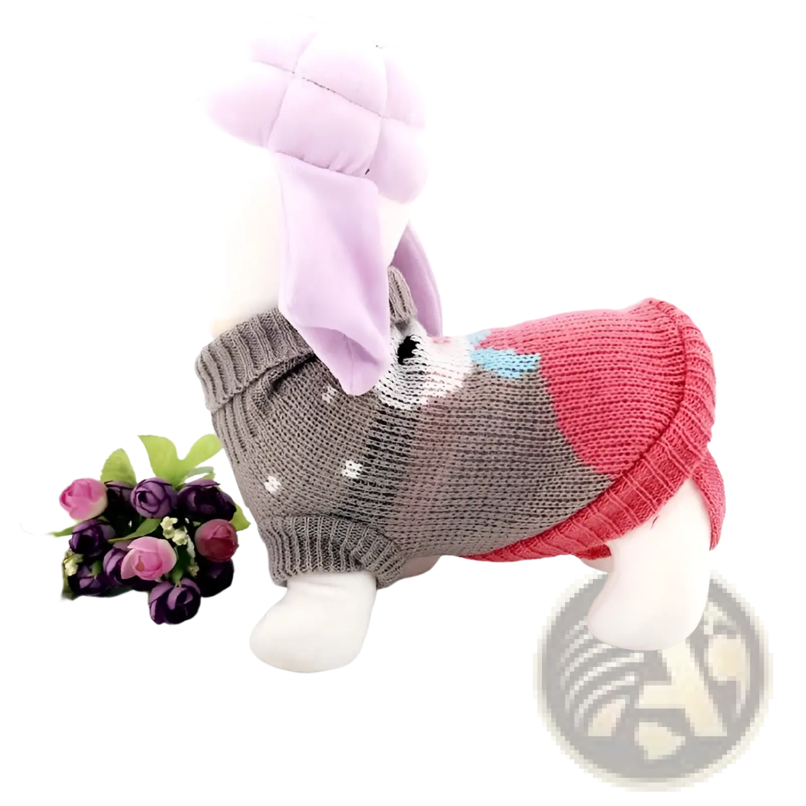 A plush white dog toy wearing a gray pink and light blue knitted festive knit pet sweater for winter apparel