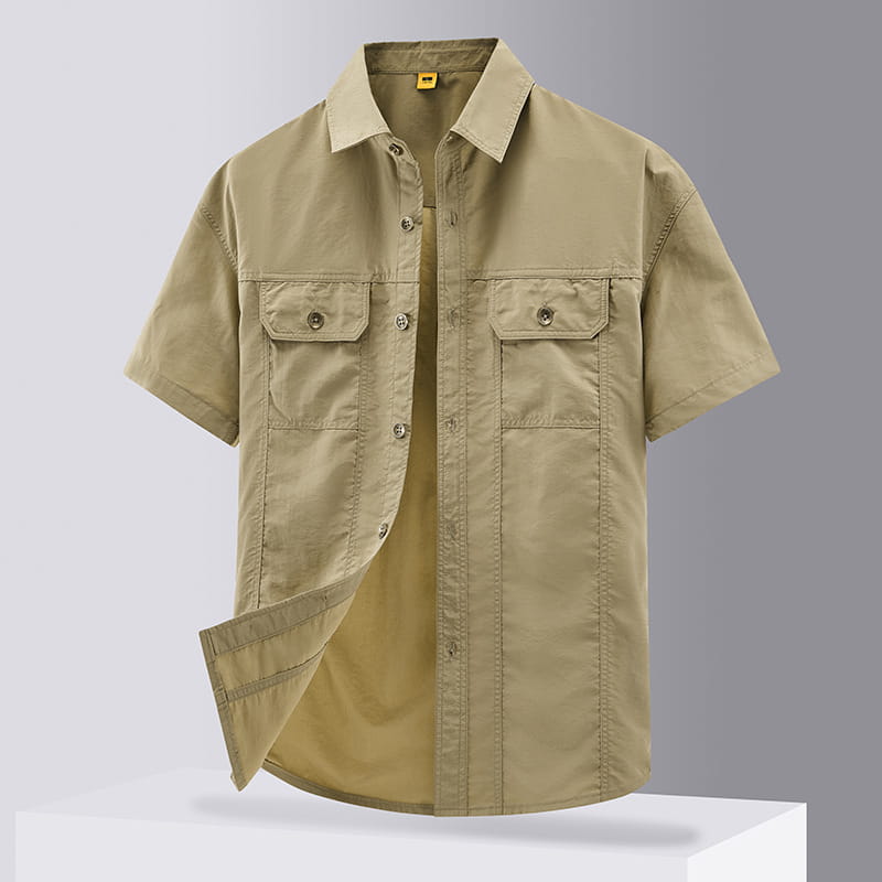 Men solid workwear shirt short sleeve in khaki featuring two chest pockets and a collar with button-up design.