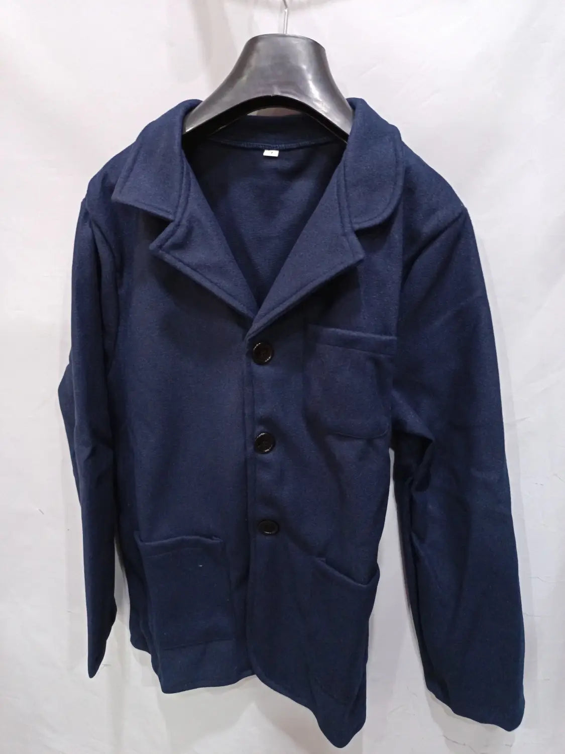 Navy blue woolen mens stand collar slim blazer jacket with black buttons and two front pockets.