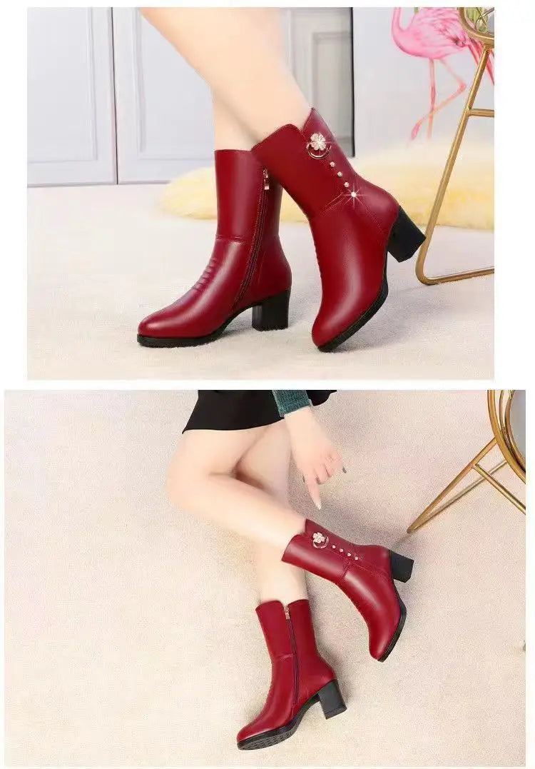 Red leather women’s martin boots featuring a floral brooch and rhinestone accents.