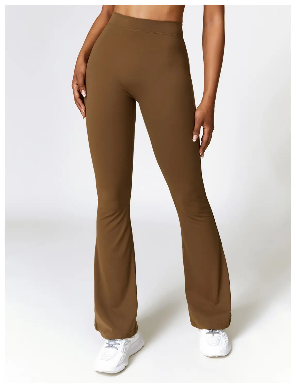 brown high-waisted flared yoga pants made of smooth stretchy fabric ideal for activewear and comfortable movement.